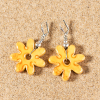 Boucles d'oreilles de créateur made in France en céramique jaune de forme fleur