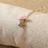Bracelet fantaisie enfant doré étoile pompon rose