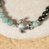 Bracelet pour homme en perles Cuora argenté bicolore et pendentif tortue