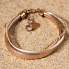 Bracelet Daphné : bracelet composé de 3 brins différents rose gold pailleté.