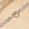 Bracelet Fimo composé d'un pendentif coeur en plaqué argent 999 et d'un cordon en tissu à motif fleuri