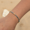 Le bracelet Taurus : un bracelet doré et bleu gris qui se marie avec tous vos bracelets.