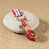 Le porte-clefs Arome est une bouffée d'air frais : avec ses perles en verre aux tons chauds, ce porte-clefs apportera de la gaieté dans vos vies.
