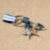 Porte-clés étoile de mer argenté perles jaune et bleu
