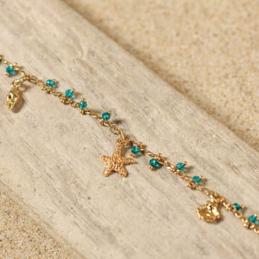 Bijou de cheville Ponta doré et perles vert émeraude, création française inspirée des lagons.