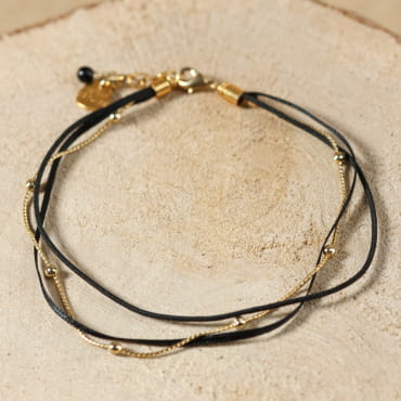 Bracelet de cheville Bombay doré à l’or fin et perles noires, bijou artisanal français raffiné.
