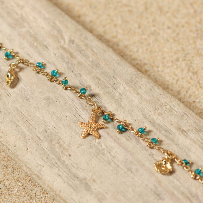 Bijou de cheville Ponta doré et perles vert émeraude, création française inspirée des lagons.