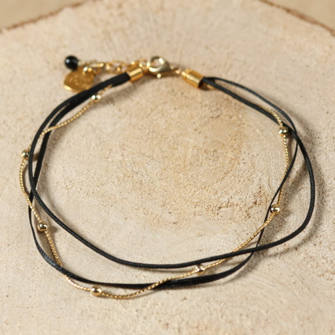 Bracelet de cheville Bombay doré à l’or fin et perles noires, bijou artisanal français raffiné.