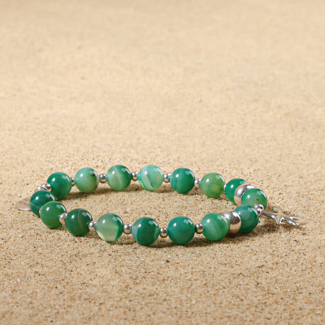 Bijou porte-clés Merlu argenté et perle blanche, création française lumineuse.