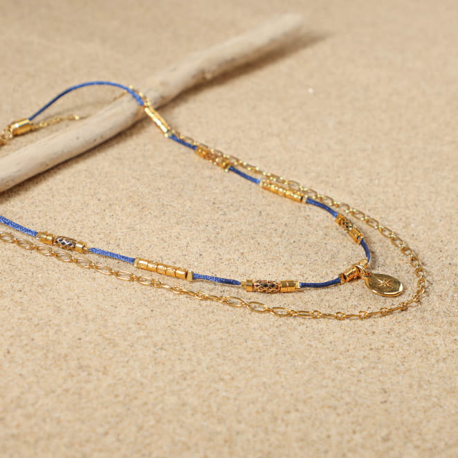 Collier Sourpi doré à l’or fin et perle bleu marine, bijou artisanal français au style marin chic